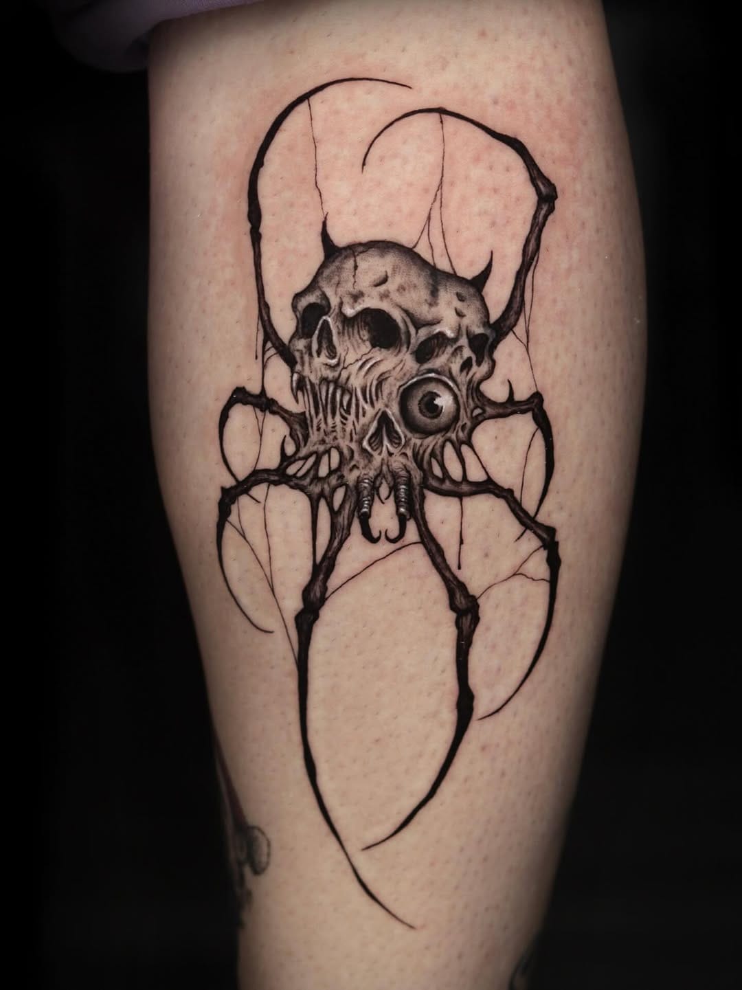 Creepy Abstract Spider And Skulls Tattoo On Leg