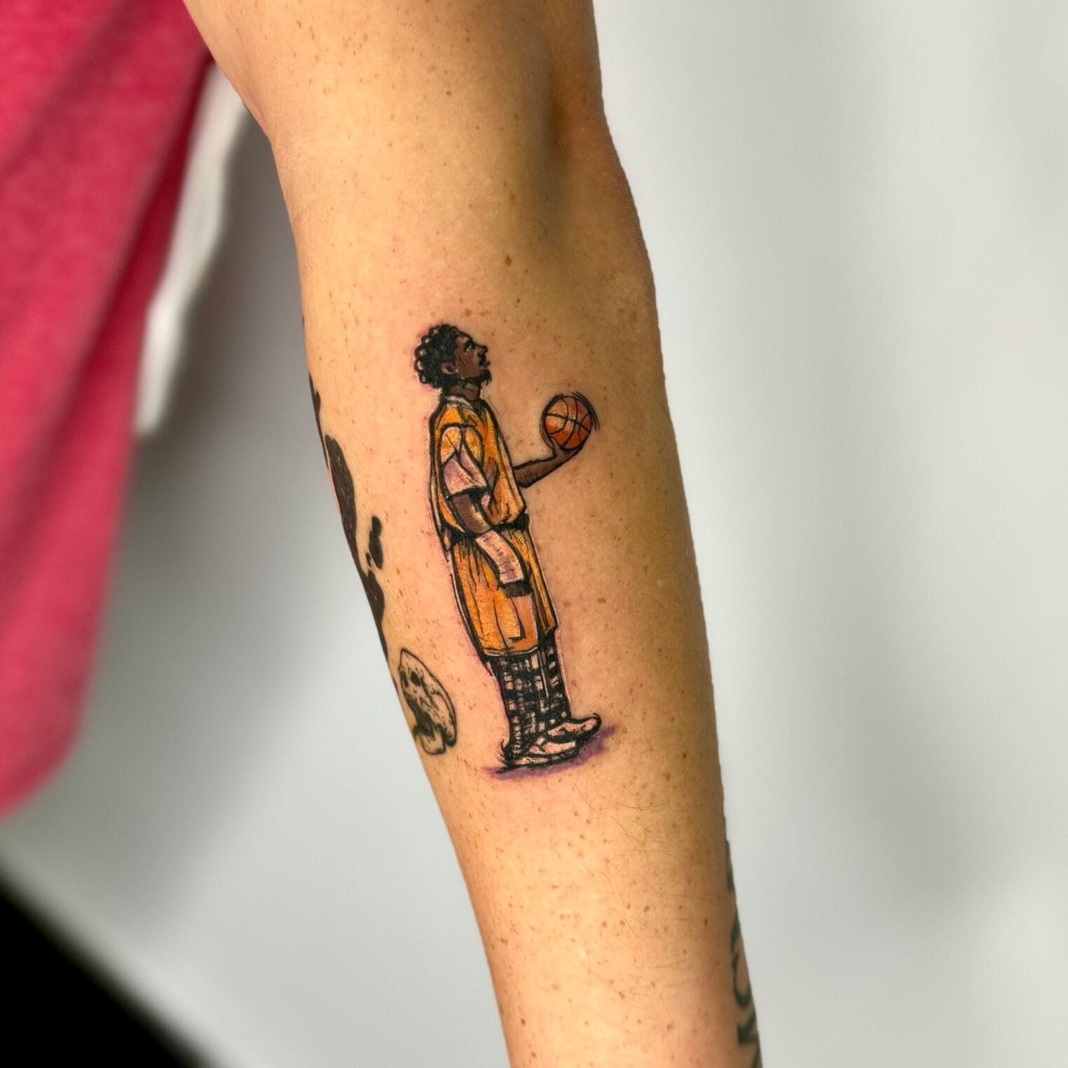 Small Basketball Fan Arm Tattoo Kobe Bryant In Pajamas