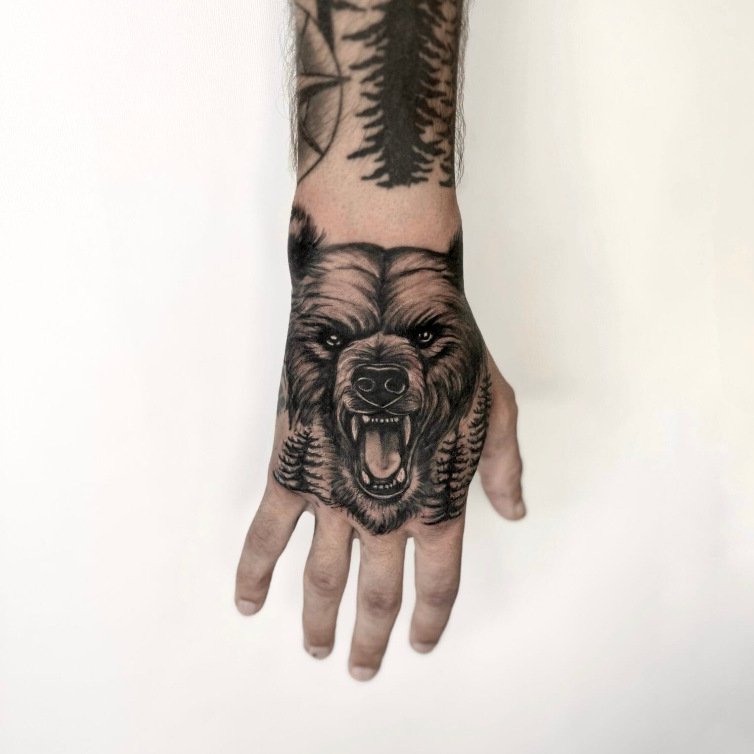 Bear Tattoo On Hand In Black And Gray