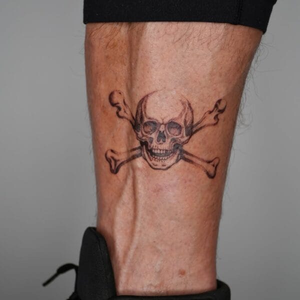 Skull And Bones Lower Leg Tattoo