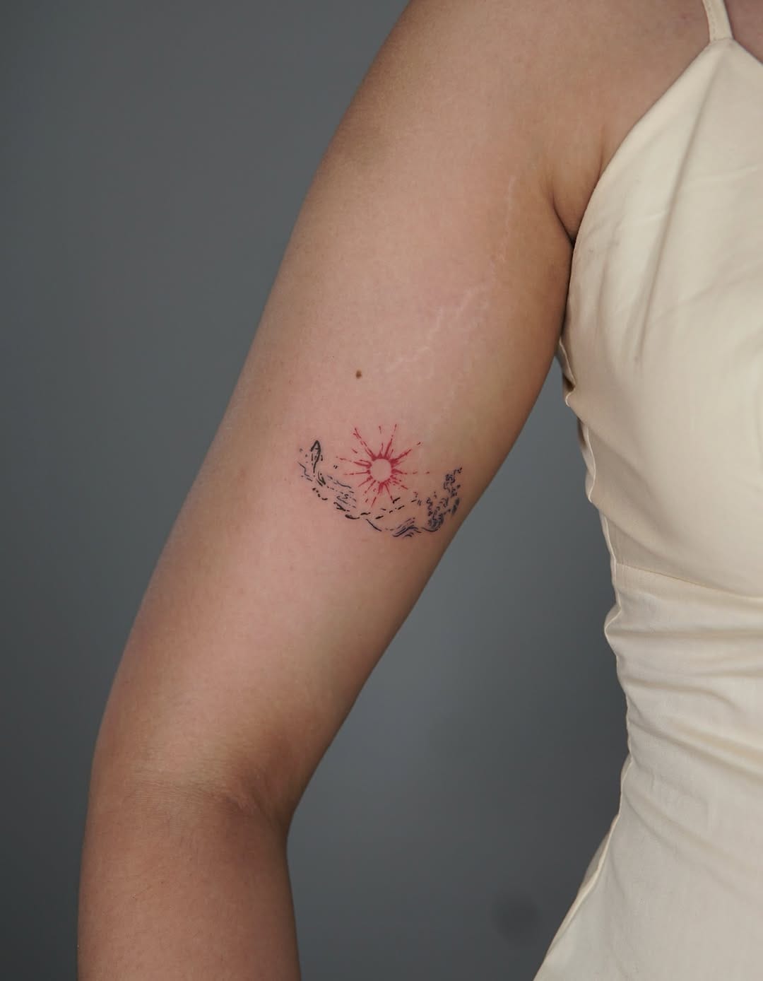 Minimalist Abstract Sun And Ocean Waves Upper Arm Tattoo