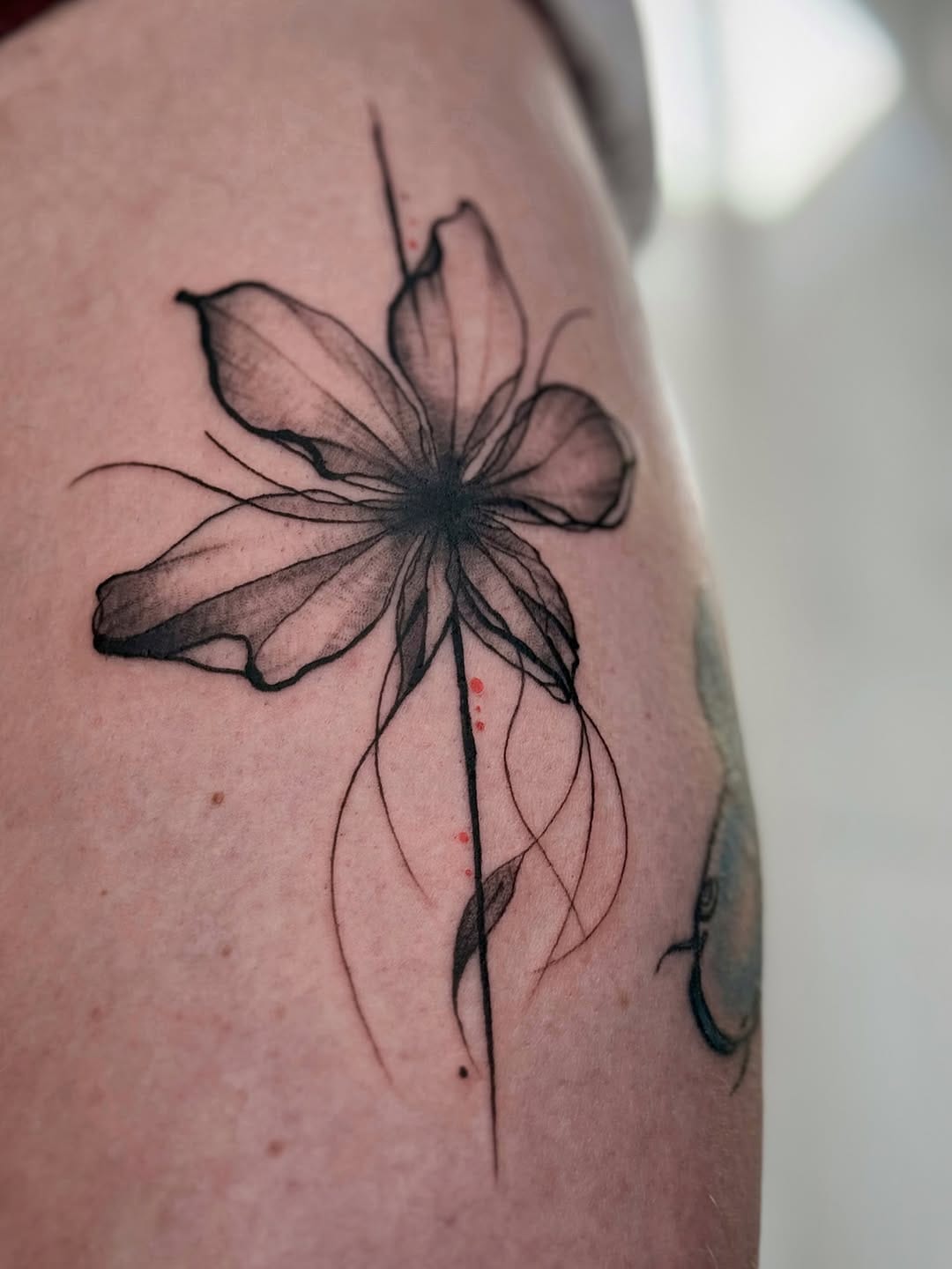 Abstract Flower Tattoo On Thigh With Fine Lines