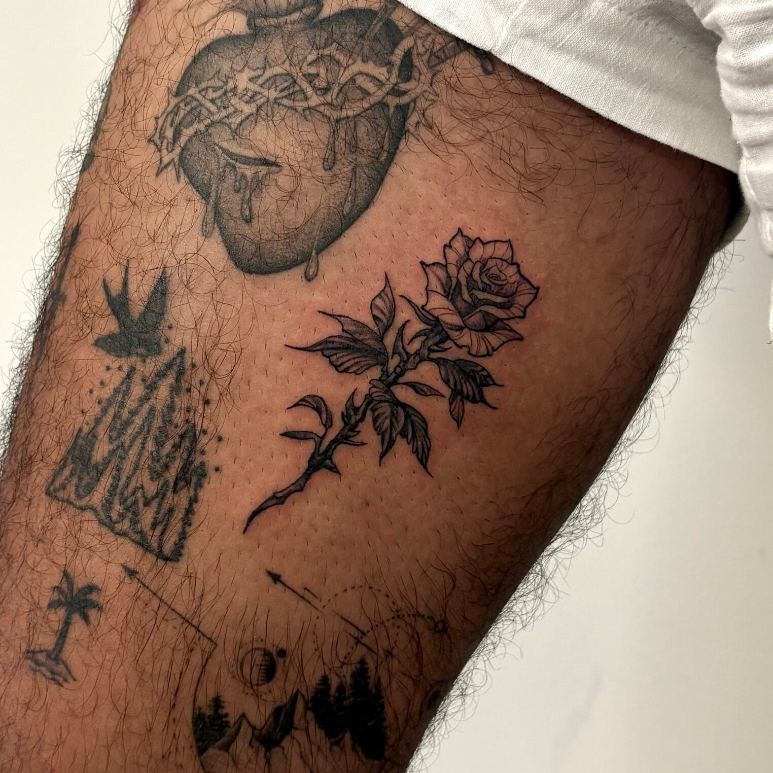Small Fine Line Rose Upper Leg Tattoo