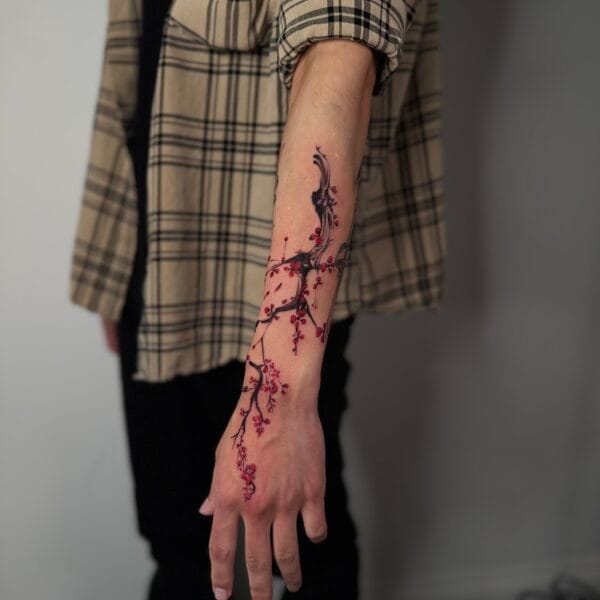 Flowy Sakura Forearm Tattoo In Abstract Style