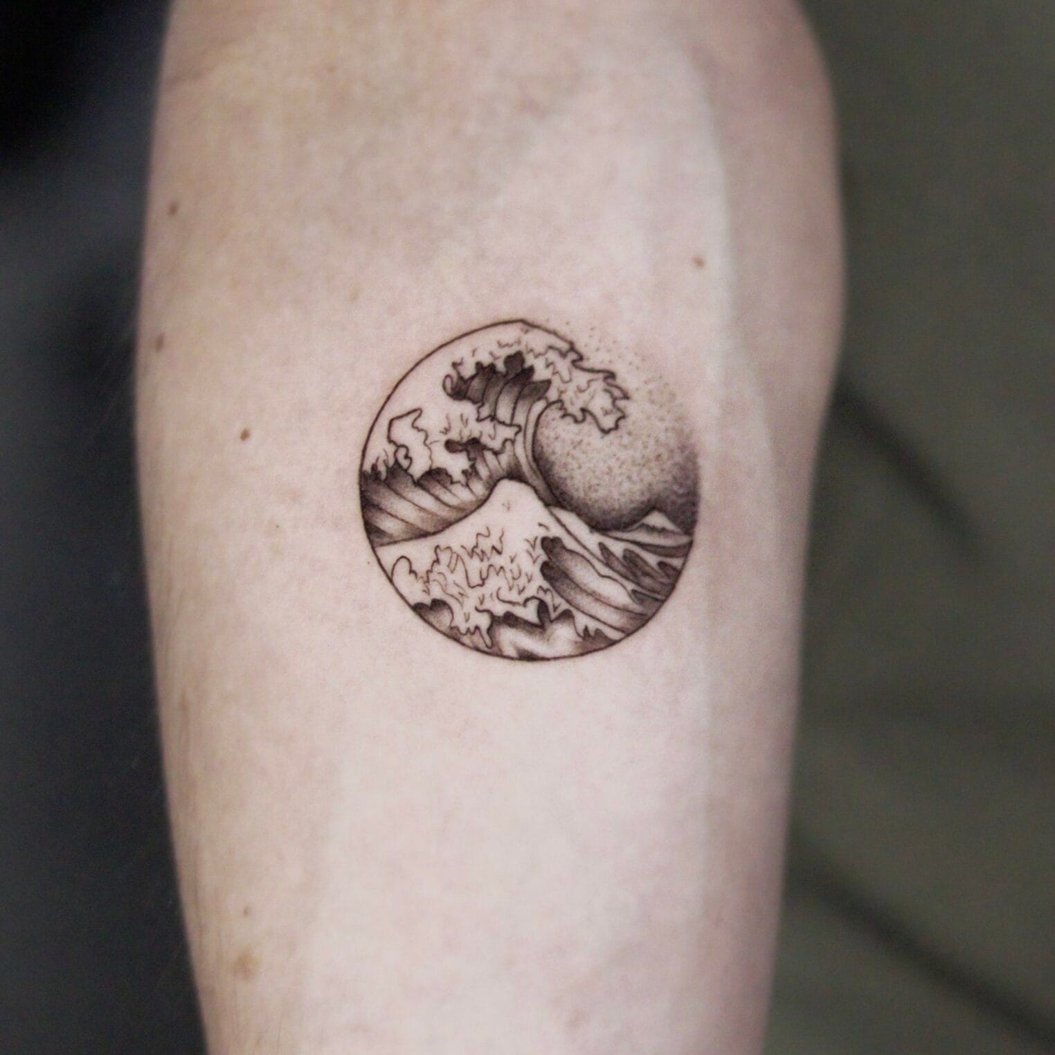 Fine Line Ocean Wave Forearm Tattoo In A Circle