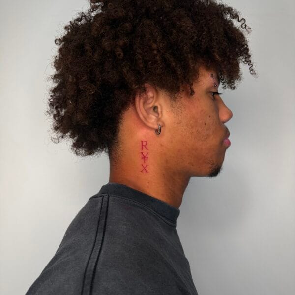 Vertical Red Lettering Neck Tattoo