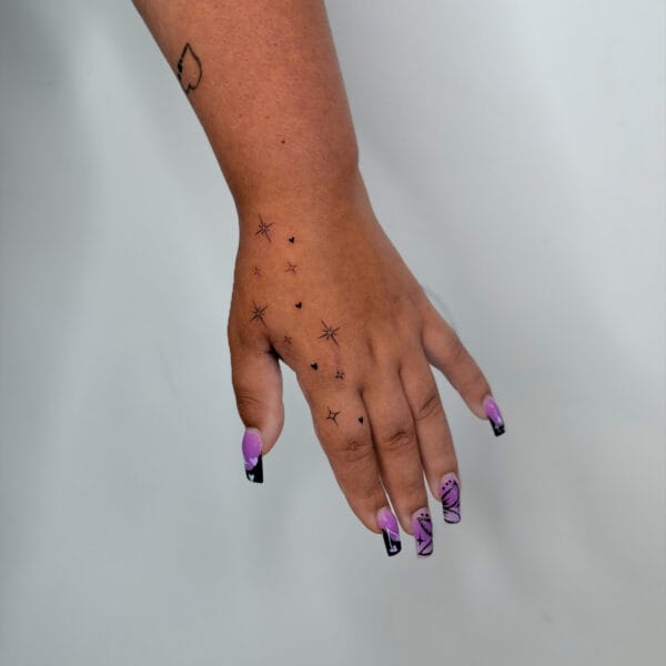 Tiny Stars And Hearts Hand And Finger Tattoos