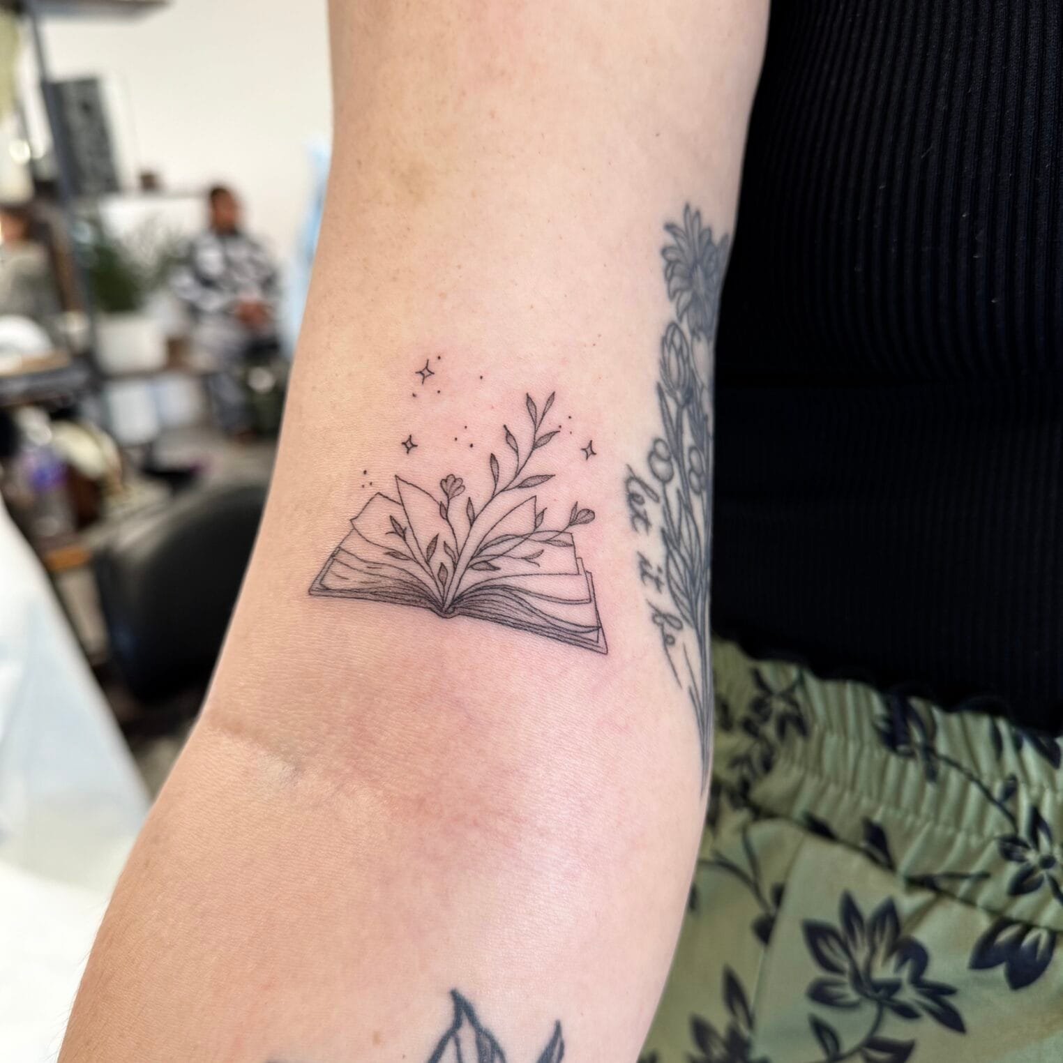 Delicate Book And Leaves Fine Line Tattoo