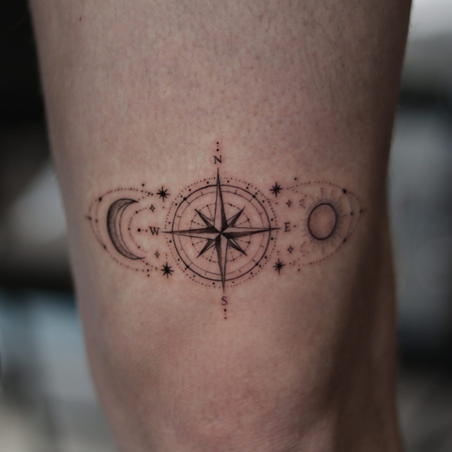 Travel Inspired Compass Tattoo Above The Knee With Stars